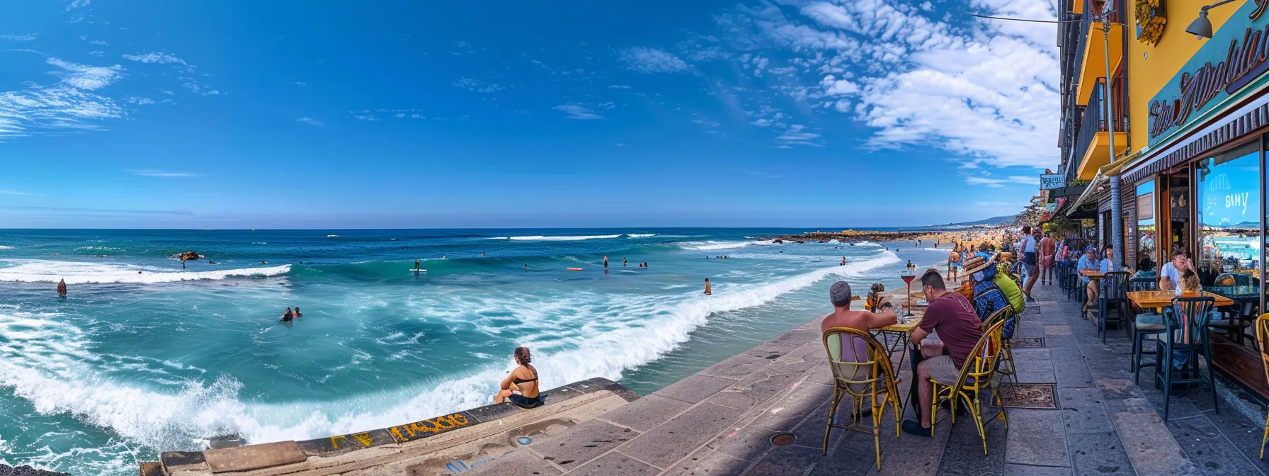 la playa de la zurriola se desliza bajo un cielo azul brillante, con surfistas desafiando las olas y un vibrante ambiente de bares que invitan a disfrutar de deliciosos pinchos junto al paseo marítimo lleno de vida.