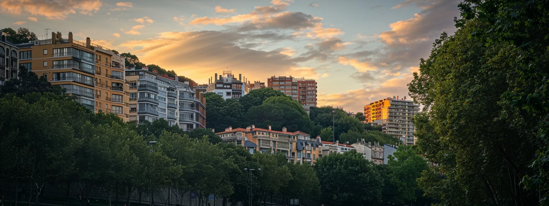 un vibrante rincón del barrio de gros en san sebastián, donde resalta la moderna arquitectura rodeada de exuberante naturaleza en el parque cristina enea, iluminado por la suave luz del atardecer.