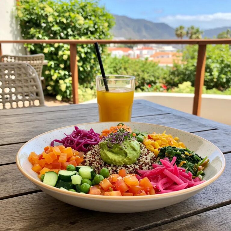 Colorful Buda Bowl with quinoa and fresh vegetables on a sunny terrace in Tenerife